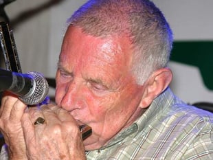 Tributes paid to folk musician and family man
