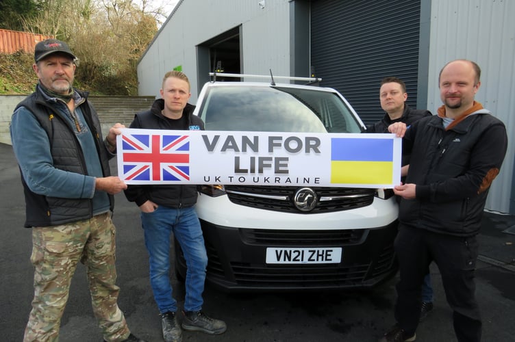 Colin Clarke, Adam Wrobel, Ben and Dan Gerry from Tavy Signs with the Van for Life banner. Colin is appealing for funds to buy a van to take Ukrainian refugees to safety
