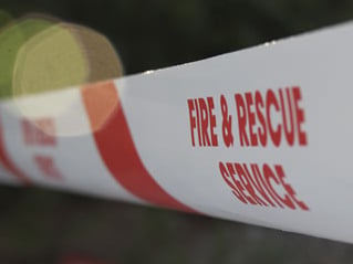 Firefighters tackle combine harvester on fire