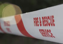Firefighters tackle combine harvester on fire near Exbourne