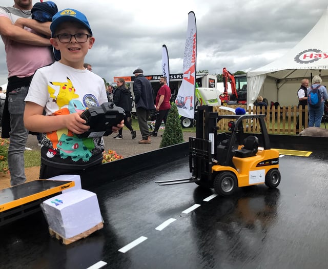 Mini forklifts on trade stand pull in young fans