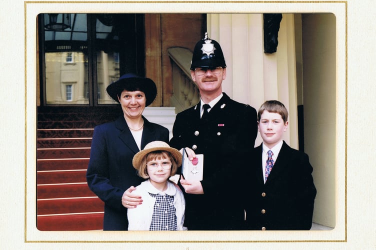 Simon Dell at Buckingham Palace receiving his MBE , with wife Shirley and children Matthew and Laura in 1997