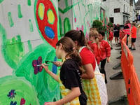 Schoolchildren create new mural for village