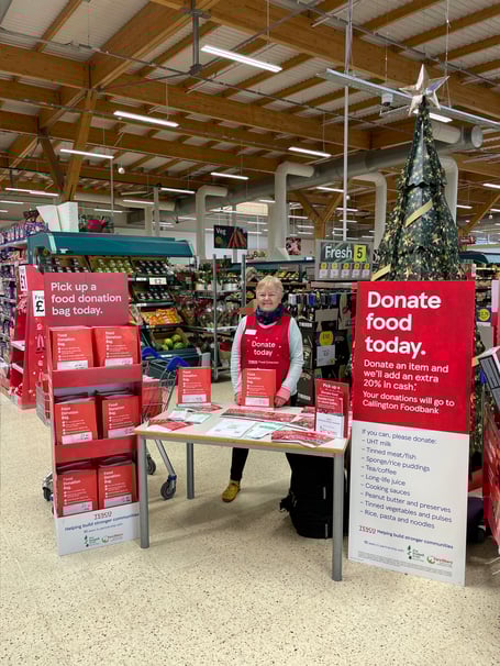 Helene Bryant, one of the Callington Foodbank warehouse volunteers in Callington Tesco encouraging shoppers to donate food items for the Tesco Winter Food Collection.