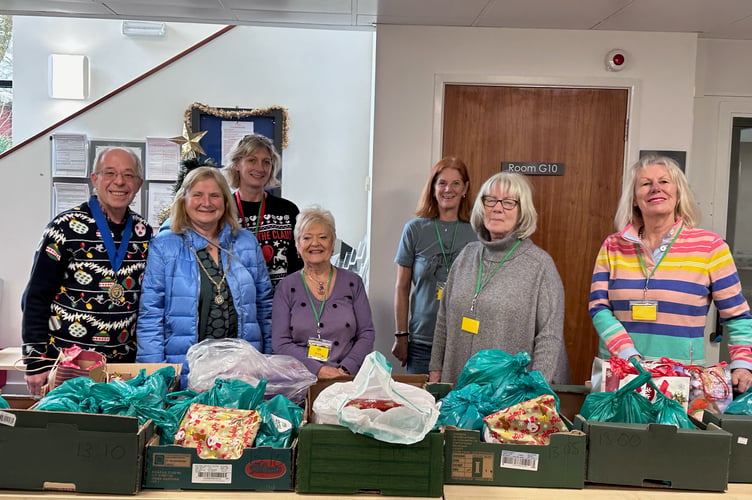 Mayor and mayoress Andy and Sue Hutton, left, with volunteers at the packaging of the Tavi Helps Christmas packages at Kilworthy Park