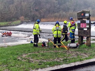 Biker rescued from river dam