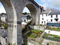 "Enchanting" cottage for sale beside viaduct has panoramic river views
