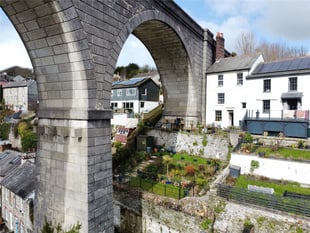 "Enchanting" cottage for sale beside viaduct has panoramic river views