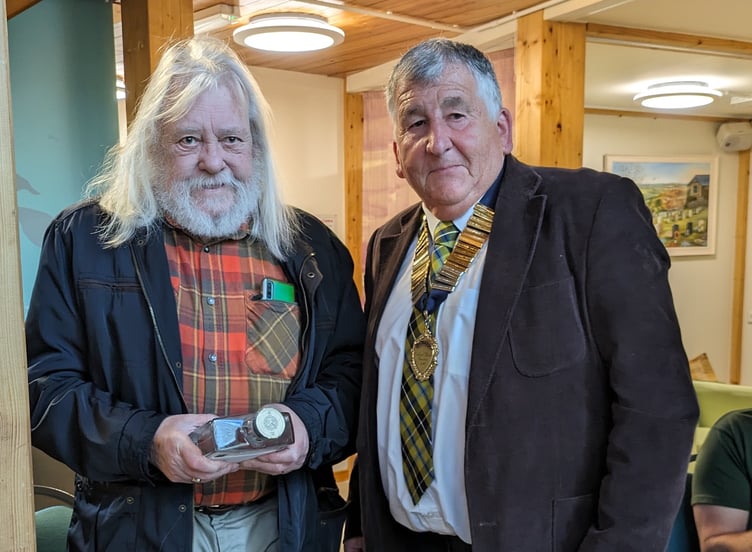 Ian Beech is thanked for 12 years' service to Calstock Parish Council by parish council chairman Jim Wakem