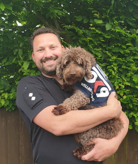 Inspector Nathan Walker and Bertie his wellness dog.