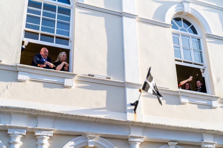 The mayor and deputy mayor and consorts then threw pennies and fruit out of the Guildhall windows to the town’s children waiting below