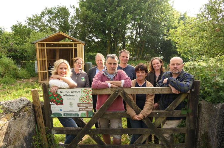 A photo of Cllrs Ursula Mann and Neil Jory with Milton Abbot Allotment Group members. 