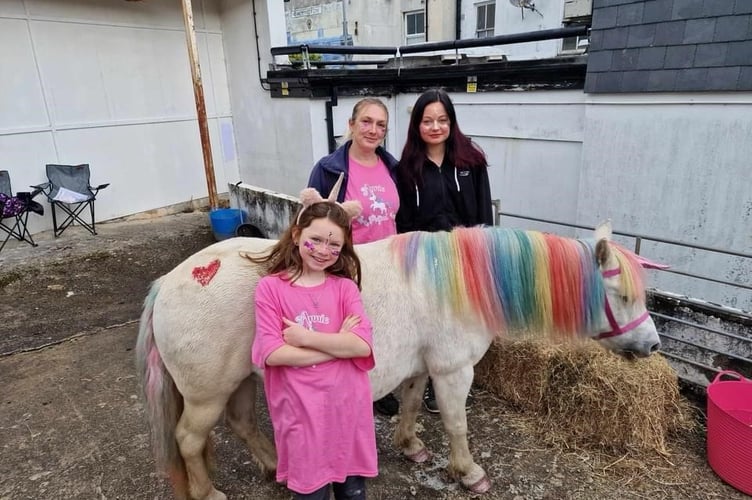 Annie the Unicorn with her helpers