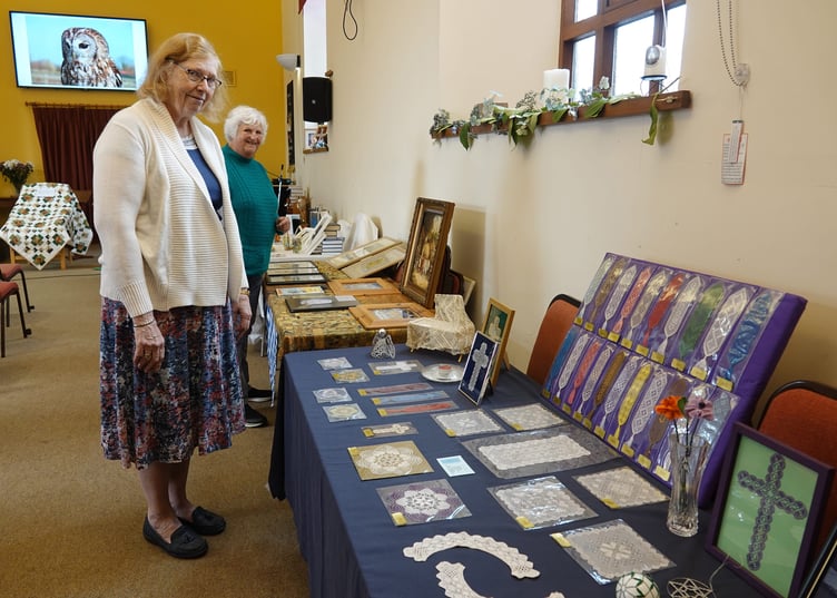 Joint organisers Rosie Bone and Glenys Whelan with the display of crafts at Bere Alston United Church. Glenys also made the lace items and baked the harvest loaf. Pictures by Ann Parsons