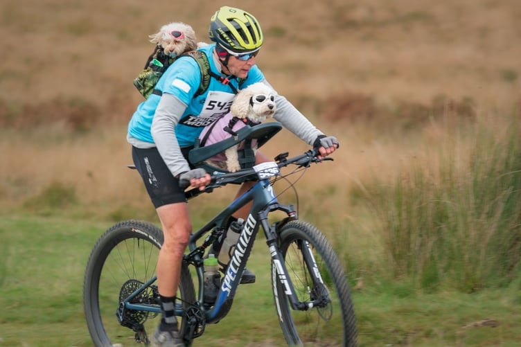 Mark Wheeler with his dogs Harper and Bella on the gruelling charity mountain bike challenge St Luke's Tour De Moor.