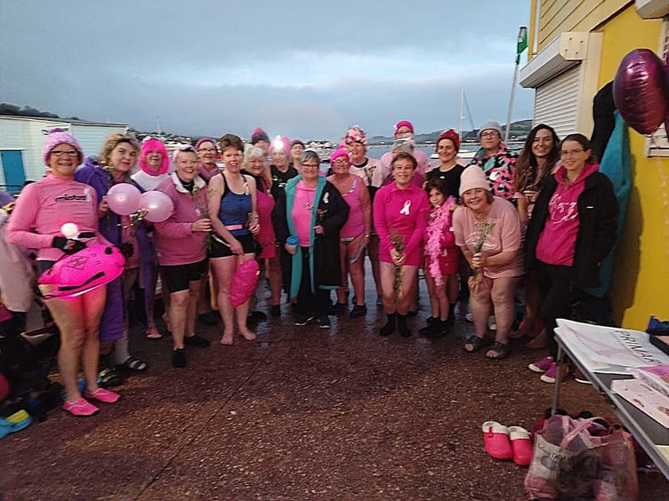 Teignmouth Mermaids in pink on Teignmouth's back beach
