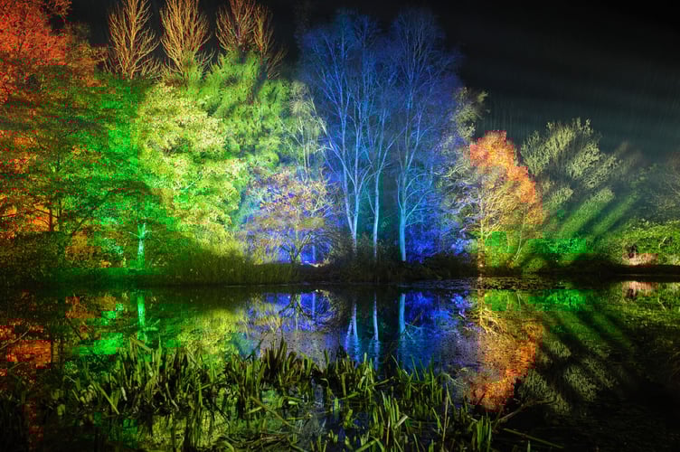 Photo by Guy Harrop. Pictured are lght displays across the lake on the first night of the spectacular Glow illuminated trail at RHS Garden Rosemoor in Devon. This yearâs event, in its 7th year features over 1800 lighting arrangements around the gardens and woodland, with over 120 sculptures lit along the trail. The event runs on selected dates until the 30th December. ..image copyright guy harrop.info\@guyharrop.com.07866 464282