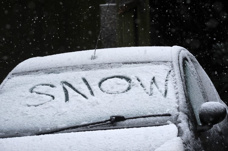 Heavy snow falls across Devon on November 21, 2024. One car driver states the obvious on his windscreen