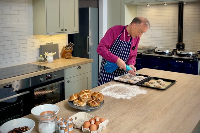 Bishop of Exeter prepares for Easter by baking hot cross buns
