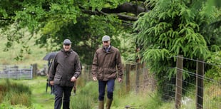 Prince William visits Princetown amid biblical rain