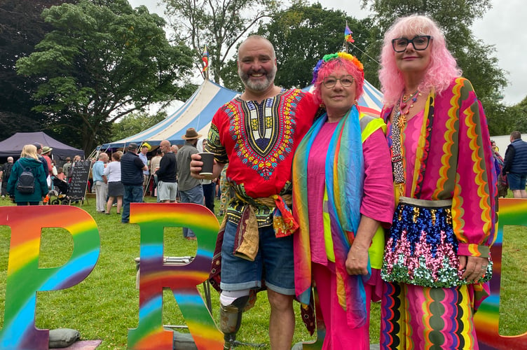 Rowing marine Lee Spencer and his wife Claire, right, enjoying Tavi Pride on Saturday with organiser Pauline Ricketts, centre,