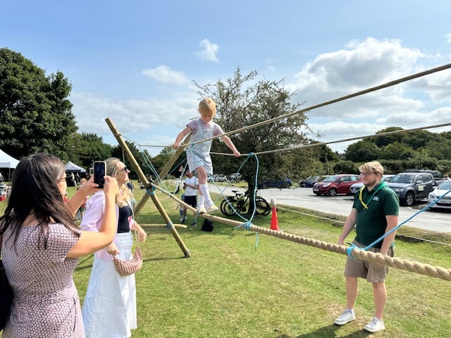 Taking it one step at a time on the rope bridge of the Yelverton Rotary Fun Day.