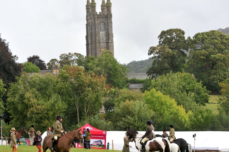 Widecombe Fair. Horse judging in main ring the shadow of  the Cathedral of the Moor , Widecombe's St Pancras Church
