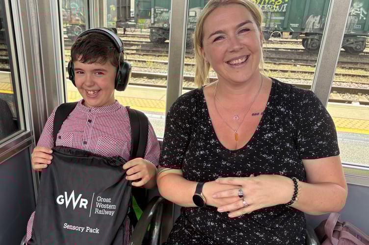 Brodie Pollock, 11, has benefitted from GWR’s autism-friendly initiatives, travelling on the train regularly with his parents, Richard, a driver depot manager, and Hayley. Photo GWR