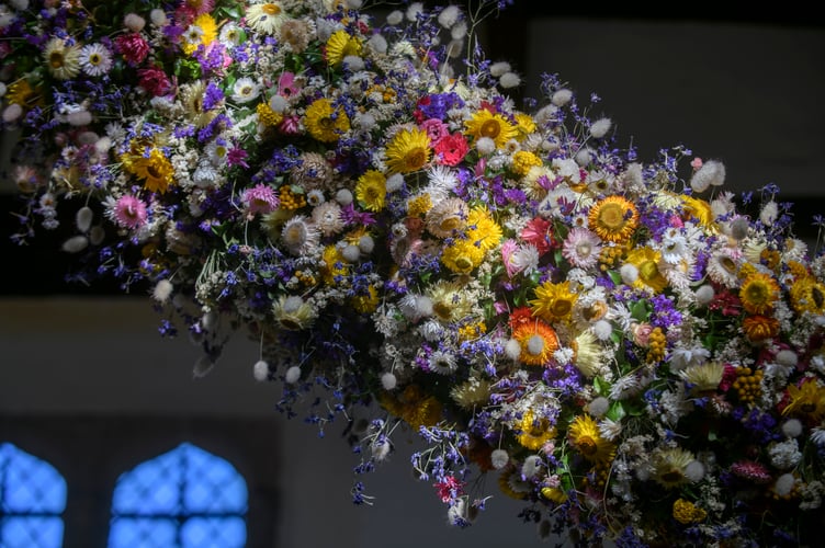 A total of 38,000 dried flowers grown, harvested and hand-placed at the National Trust estate have created the biggest ever garland