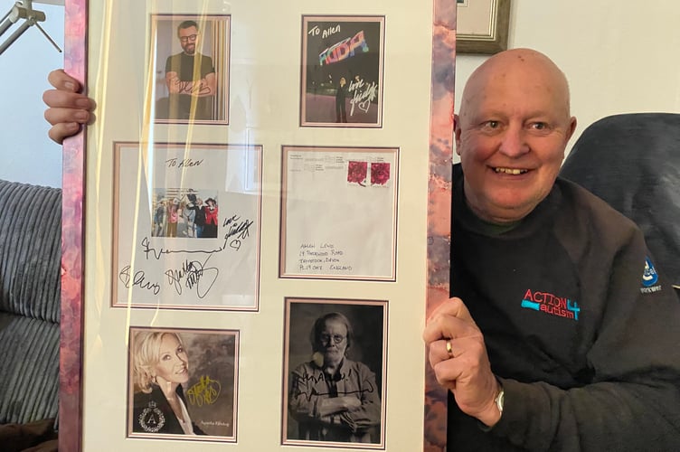 Tavistock resident Allen Lewis with his treasured rare photograph of himself as a mounted police officer with Abba, complete with all their signatures.