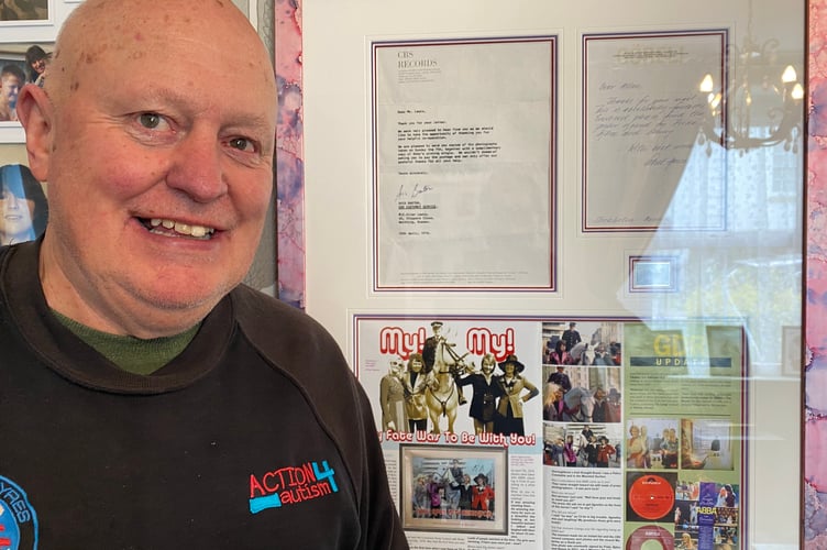 Allen Lewis with his prized Abba memorabilia, in which he features, showcased on Tavistock home wall.
