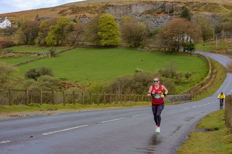 Okehampton Running Club member Joanne Page cuts a lonely figure as she leads the women entrants in the Dartmoor Marathon at Merrivale. She continued to finish first woman. Picture by Charles Whitton Sports Photography.