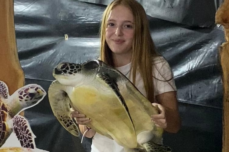Walkhampton cricketer Charlotte Shutt, 15, on tour with Devon-U15 Cricket in Sri Lanka, enjoying a visit to a turtle sanctuary.