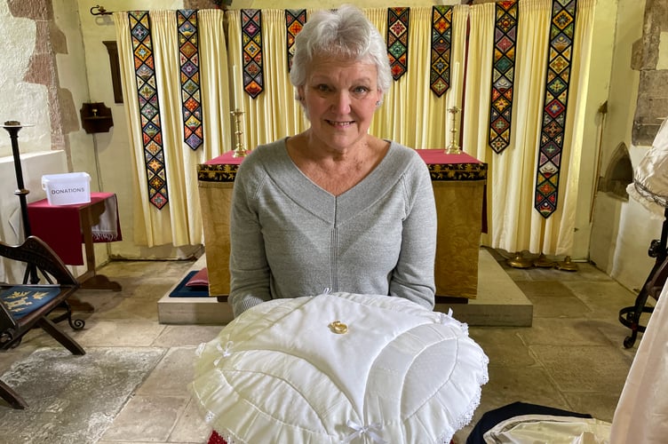 Ann Burnett with a ring cushion she made for St Mary's Church
