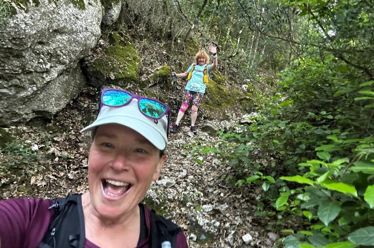 Dotty King and friend Janice Fuller support each other on the challenging mountain race during the Corfu 15-mile night race.