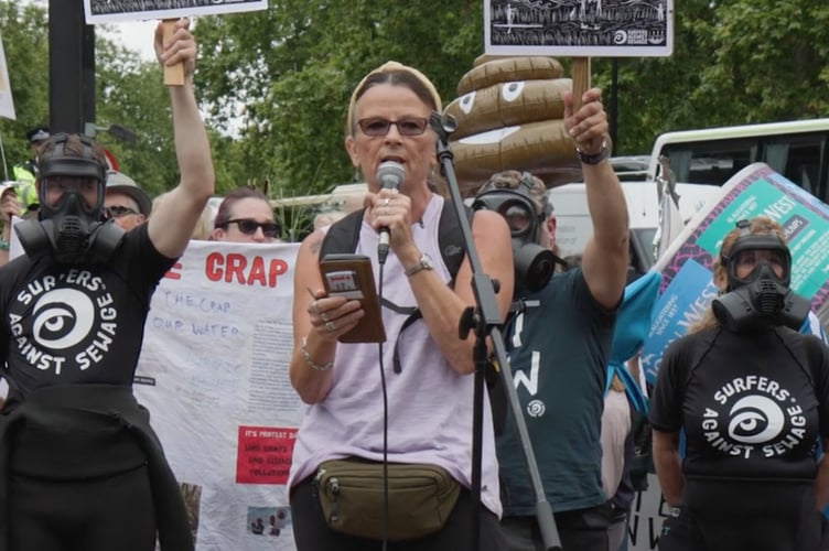 Water pollution activist Jo Bateman is pictured taking part in a protest led by Surfers against Sewage. A film 'Jo in the Water', highlighting her campaigning will be screened in June in Tavistock Library. Picture courtesy of Fair View Films.