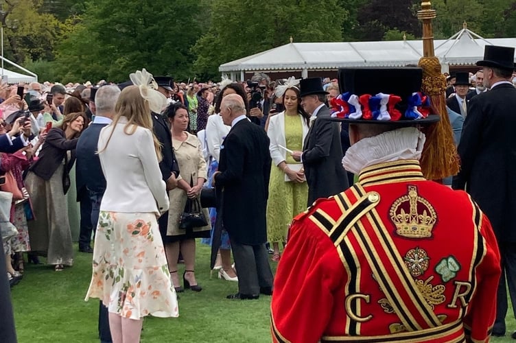 Deb Morris, manager of Tavistock Area Support Services (TASS), attended Buckingham Palace garden party and
snapped His Majesty The King chatting to fellow guests.