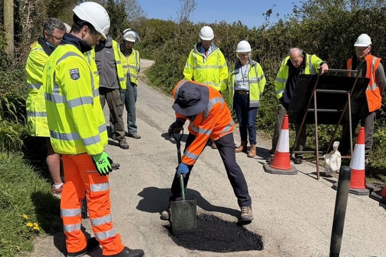 Road wardens receiving pothole repair training