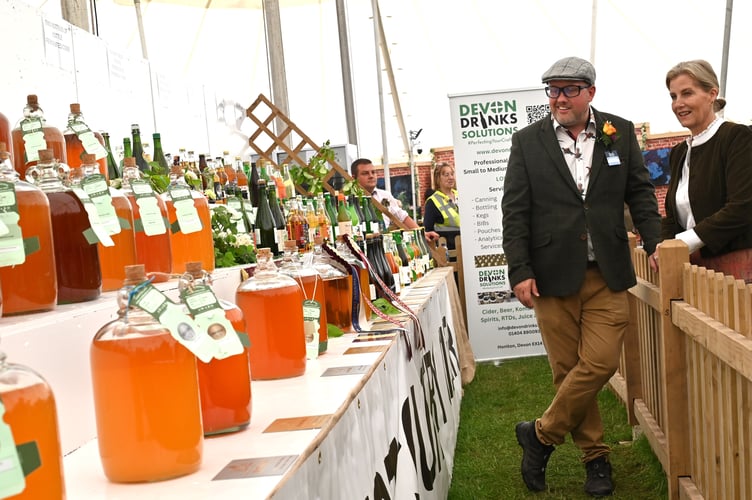The Duchess views the prize-winning ciders in the food and drink marquee