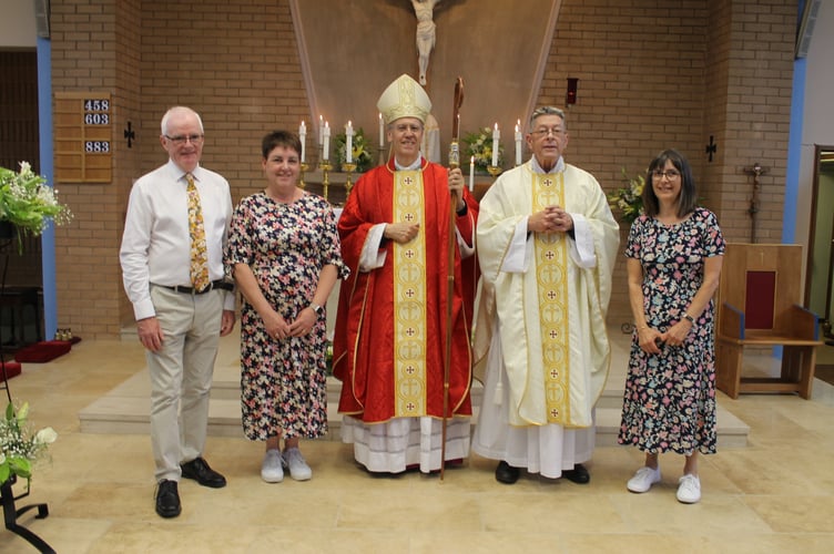Bishop Nicholas Hudson, centre with, left, Dan Fitzgerald and Caroline Parkes and right, Father Michael Wheaton and Nicola Nathan. AQ 1514