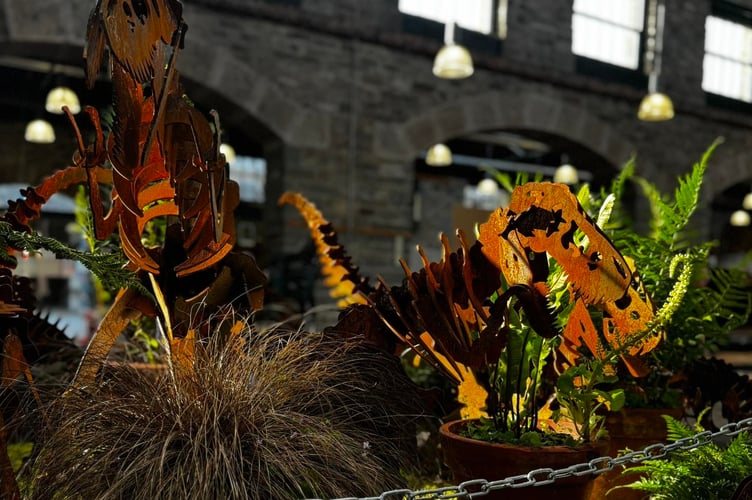 Philip King, of Rusty Relics, impressed with his dinosaur sculpture garden display at Tavistock Pannier Market Garden Country Show.