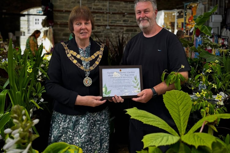 Tamar Valley Nursery receives a green-fingered award from new-elected Mayor Cllr Anne Johnson at Tavistock Country Garden Show in the Pannier Market. Picture Tavistock Town Council.
