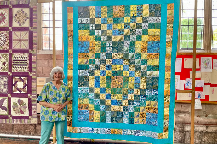 28 May 2026 Quilt exhibition Cathie Holden's daughter made the linocut prints for her quilt (Will Goddard, Crediton Courier)