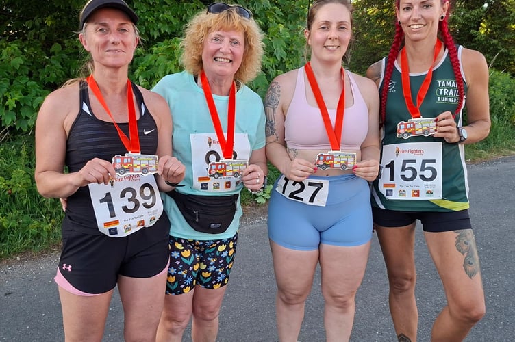 Five friends from Tavistock and Bere Alston show off their medals after conquering the Princetown Firefighters 10km on a hot night in aid of the Fire Fighters Charity.