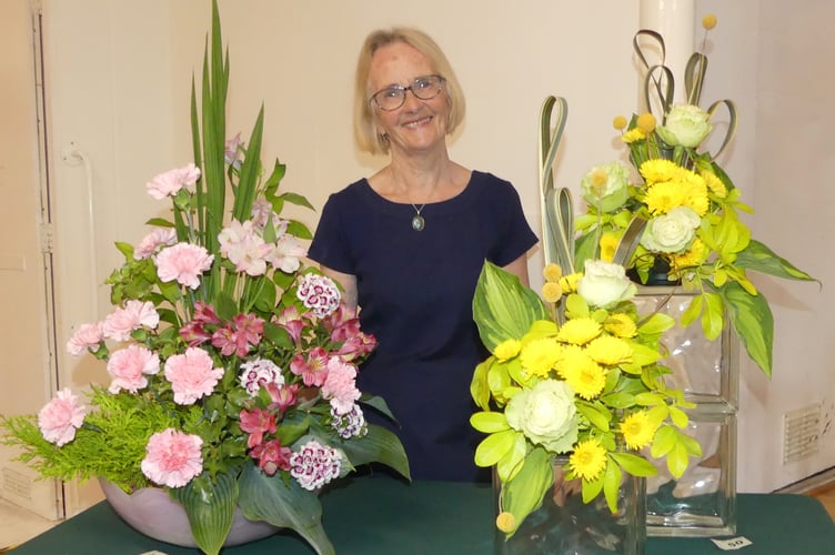 Demonstrator Angela Chanter with her arrangements at the May meeting of Tavistock Flower Club. Picture: Deborah Asbridge.