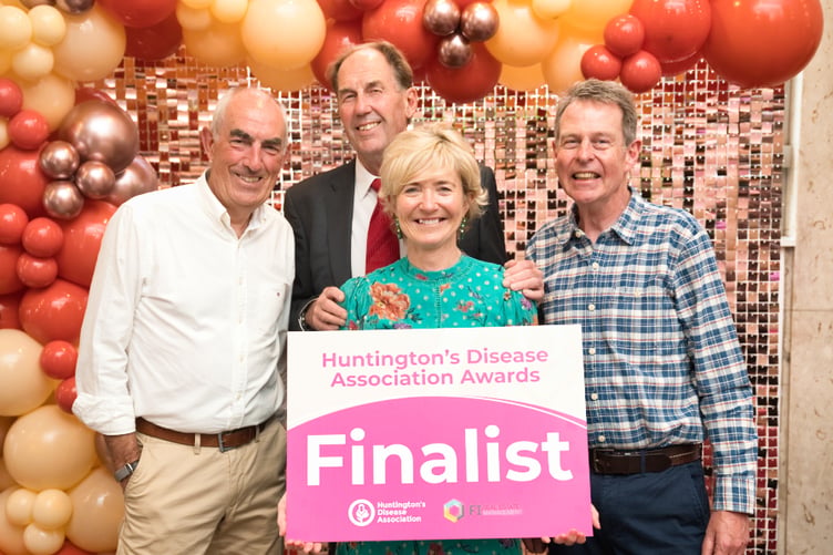 Tavistock Wheelers Cycling Club members were presented with an award marking their Tavistock-to-London ride in aid of the Huntington's Disease Association.