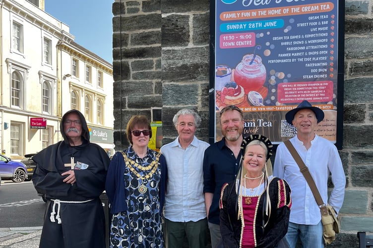 A line-up of judges at Tavistock Cream Tea Festival and fete which included Town Mayor Cllr Anne Johnson (second left), thriller writer Terry Green (far right) and costumed Edge Players.