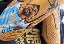 Messi football boots auctioned in World Cup boost for animal sanctuary