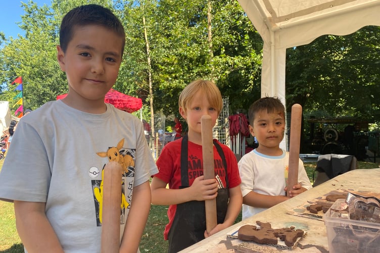 Youngsters have a go at making clay figures with Andy Cairn of West Devon Art Workshops at Tavistock Lions family fun day in the Meadows park.