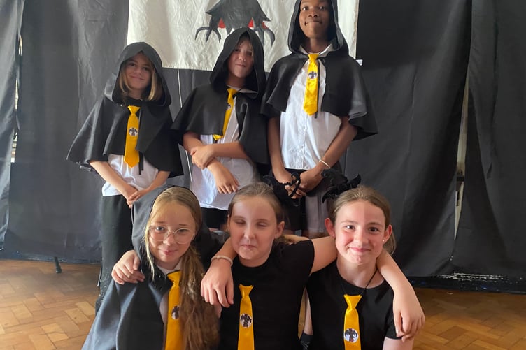 Tavistock Primary School's summer production of When Thursday Became Wednesday horrified then spread happiness into audiences. Pictured are some of the talented singer/performers.